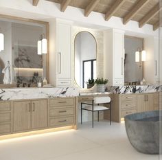 an elegant bathroom with marble counter tops and wooden cabinets, along with large mirrors on the wall