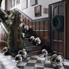 a staircase decorated with christmas decorations and balls