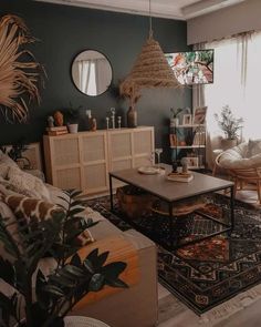 a living room filled with lots of furniture next to a large window and potted plants