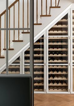 there is a wine rack under the stairs