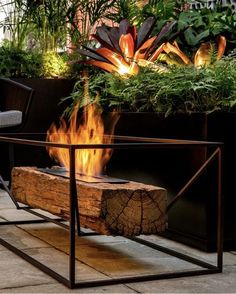 a fire pit sitting on top of a wooden table