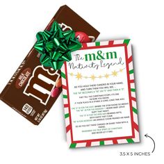 the m & m christmas candy bar is next to a card that says merry and has a green bow on it