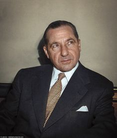 an old photo of a man in a suit and tie