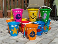 colorful buckets with names and pictures on them