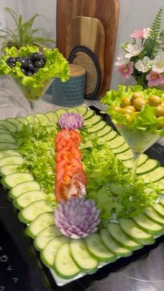 an assortment of fruits and vegetables are arranged on a platter, ready to be served