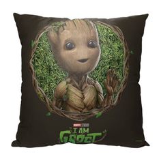 a pillow with an image of a baby groote holding the words i am groot