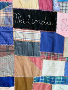 a colorful quilt with the name melinda written on it