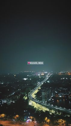 an aerial view of a city at night with the word india written on it's side