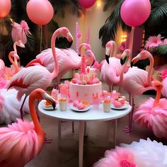 pink flamingo themed birthday party with cake and balloons in the shape of flowers, feathers and candles