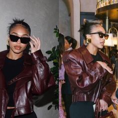 two women wearing leather jackets and sunglasses