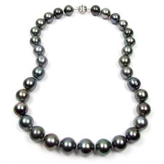 "Absolutely gorgeous and rare single 18\" strand (length including the clasp) 100% authentic Tahitain black pearl necklace strand with 14K solid white gold clasp Pearl: a total of 33 100% authentic fine quality A & B grade (Please refer to the below A-D pearl grading system for details) Tahitian black pearls Pearl measurement: 11.5-14.2mm in diameter (11.5mm pearls at the ends and 14.2mm in the center) Color: all natural black with beautiful green overtone (not dyed or treated) Shape: round Classic Tahitian Pearl Necklace With Round Beads, Classic Tahitian Pearl Round Bead Necklaces, Classic Tahitian Pearl Necklace With High Luster, Classic Tahitian Pearl Round Bead Necklace, Classic Tahitian Pearl Beaded Necklace, Classic Round Tahitian Pearl Necklace, Classic Tahitian Pearl Jewelry With Round Beads, Classic Round Tahitian Pearl Necklaces, Classic Tahitian Pearl Round Necklaces