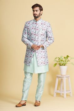 Pista green bandhgala with floral printed motifs and patch pocket. Paired with aligarhi pant and sleeveless kurta.
Component: 3
Pattern: Printed
Type Of Work: Floral
Neckline: Mandarin
Sleeve Type: Full Sleeves
Fabric: Art Banarasi Silk, Printed Art Banarasi
Color: Green
Other Details: 
Floral print
Front buttons
Note: Pocket square worn by the model is not for sale
Occasion: Sangeet - Aza Fashions Fitted Floral Print Bandhgala For Festive Occasions, Festive Floral Print Fitted Bandhgala, Festive Fitted Floral Print Bandhgala, Traditional Wear With Printed Motifs For Formal Occasions, Traditional Pista Green Kurta With Floral Print, Traditional Nehru Jacket With Floral Print For Designer Wear, Diwali Bandhgala With Printed Motifs, Traditional Formal Sets With Floral Print, Traditional Floral Print Formal Set