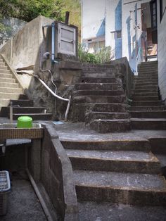 there is a set of stairs leading up to the top floor and bottom part of the building