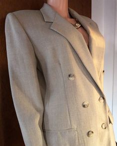 A vintage double breasted blazer that's in excellent vintage condition. It has shoulder pads. Neutral in color. Pictures are true to color. Sized 8 and shown on a size 8 mannequin. Sleeves 22.5 inches long. Cheap Double-breasted Formal Blazer, Affordable Double-breasted Chic Blazer, Cheap Double-breasted Blazer With Button Fastening, Chic Double-breasted Blazer, Cheap Double-breasted Spring Blazer, Cheap Fitted Double-breasted Blazer, Cheap Chic Double-breasted Blazer, Cheap Blazer With Double Button Closure, Luxury Solid Double-breasted Blazer