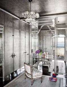 an ornately decorated dressing room with mirrored walls