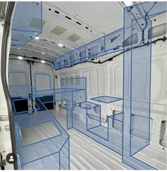 the inside of a white van with blue lines on the floor and shelves in it