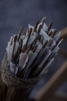 a basket filled with lots of brown and white umbrellas