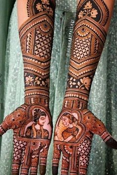 two hands with henna designs on them