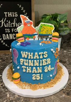 a blue cake with an image of spongebob on it and what's runner than 28?