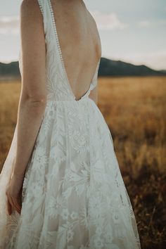 the back of a woman's dress in an open field