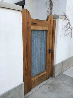 an open wooden door on the side of a building