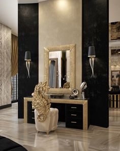 a black and white room with a gold mirror on the wall next to a chair