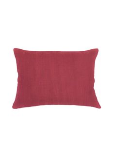 a red pillow on a white background