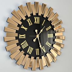 a gold and black clock with roman numerals on it's face is shown