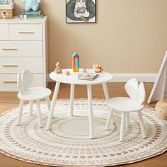 a child's table and chairs in a room