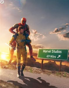 two people dressed as deadpooles are walking down the road in front of a sign