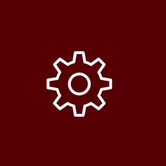 a white gear wheel on a red background