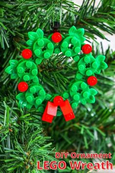 an ornament made out of legos hanging on a christmas tree with the words diy ornaments