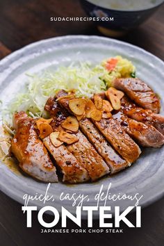 grilled pork chops with sauerkraut and shaved cabbage on a white plate