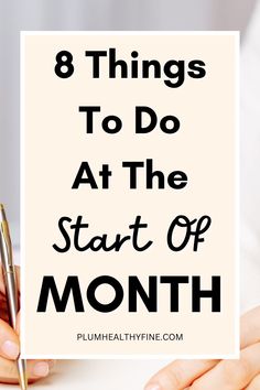 a woman's hands holding a note with the words 8 things to do at the start of month