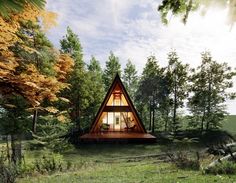 a - frame cabin in the woods surrounded by trees