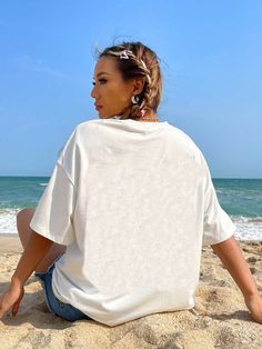 Upgrade your summer style with our Shell & Starfish Women's Drop Shoulder T-Shirt. Made with care from high-quality materials, this shirt features a unique shell and starfish design that will make you stand out at any beach or pool party. Stay cool and stylish this summer with our must-have t-shirt. Color : Baby Blue Style : Casual Pattern Type : Letter Neckline : Round Neck Sleeve Length : Half Sleeve Sleeve Type : Drop Shoulder Length : Long Fit Type : Loose Fabric : Slight Stretch Material : Fabric Composition : 62% Polyester Composition : 34% Cotton Composition : 4% Elastane Care Instructions : Machine wash or professional dry clean Sheer : No Size US Bicep Length Bust Cuff Length Shoulder Sleeve Length Waist Size XS 2 40.60 114.00 38.60 71.30 53.90 19.80 113.00 S 4 42 118 40 72.3 55.5 White Crew Neck Top For Beach Season, White Crew Neck T-shirt For Beach Season, Starfish Design, Loose Fabric, Blue Style, Stay Cool, Shoulder Length, Half Sleeve, Pool Party