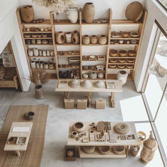 38 Modern Pottery Sanctuaries: Where Minimalism Fuels Artistic Expression Minimal Shop Interior, Clay Studio Aesthetic, Ceramic Studio Layout, Pottery Studio Home, Pottery Shelves, Pottery Atelier, Pottery Studio Aesthetic