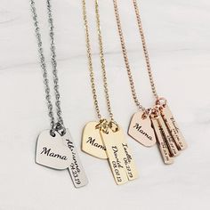 A beautiful engraved heart necklace personalized with your children's names and their date of birth. Choose between multiple colors, chain styles, and lengths that fit your esthetic best. A family necklace that you'll never want to take off. Features: Your necklace will come packaged in a dainty blue organza bag perfect for gift-giving and storing. A beautiful heart charm pendant engraved with "Mama". Choose up to 4 rectangle charm tags that will be permanently laser engraved with your child's n Engraved Heart Necklace, Necklace With Kids Names, Custom Bar Necklace, Engraving Ideas, Body Types Women, Blue Organza, Xmas 2024, Mama Necklace, Forever Gifts