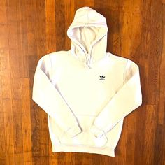 Dope off white color hoodie from the '00s. Embroidered trefoil logo and spellout on left chest. Drawstring hood. Front connector pocket. Has a tiny blemish on the back of the right sleeve but is in great condition otherwise. Fits like a Men's M.  Brand: Adidas Size: M  Color: Cream Condition: Excellent Fsu Shirts, Coca Cola Shirt, Adidas Trefoil Hoodie, Vintage Adidas Sweatshirt, Adidas Trefoil, Adidas Sweatshirt, Levi’s Jeans, Adidas Hoodie, Sweatshirt Vintage