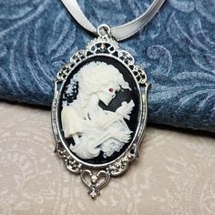 New! Skeleton Zombie Goddess Resin Cameo Pendant With Genuine Swarovski Crystal Eye, As Pictured. It Has Silver Toned Frame With A Ribbon. This Handmade Item Ships In A Gift Pouch. Thanks For Looking White Gothic Necklace Gift, Choker Pendant, Star Pendant Necklace, Lace Necklace, Black Bead Necklace, Mother Of Pearl Necklace, Wooden Necklace, Long Beaded Necklace, Cameo Necklace