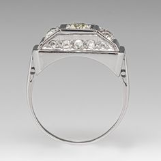 This lovely ring is centered with one (1), bead set, old European cut diamond. The center stone is flanked to each side by two (2), bead set, old European cut diamonds. The side faces of the ring are each accented with five (5), bead set, rose cut diamonds. The ring measures 8.4mm at the top, rises 5.8mm above the finger, tapering to 1.4mm wide and 0.6mm thick at the base of the shank. It is currently a size 6. Two of the rose cut diamonds have an unnoticeable chip. European Cut Diamond Ring, Brand Presentation, European Cut Diamonds, Lovely Ring, Rose Cut Diamond, June Birth Stone, High Quality Jewelry, Rose Cut, Estate Jewelry