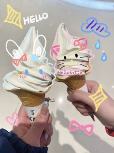 two people holding up ice cream cones with hello kitty designs on them and the words hello kitty