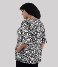 Take your look to the next level with this stylish black and white wildflower printed plus size tunic. The Junonia® tunic features our beloved Stretch Naturals Lite™ fabric for a comfortable and flattering fit with 3/4 sleeves and handy pockets. Feel confident and inspired in this fashionable yet functional design! Imported High-Tech Fabric 95% Cotton / 5% Spandex Fabric provides comfort and full range of motion High-quality material, the perfect balance of midweight and breathability Design Det Black Floral Print Top With 3/4 Sleeves, Plus Size Tunics, Plus Size Tunic, Pear Body Shape, Lounge Bra, Pocket Tunic, Tank Top Bras, Stylish Plus, Range Of Motion