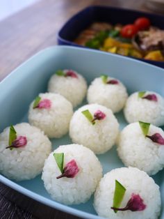 some food is in a blue bowl on a table