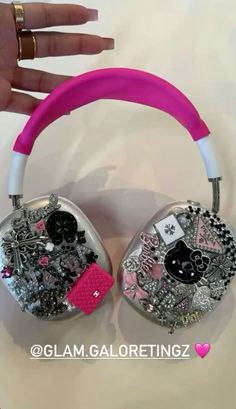 a pair of headphones with buttons and other things on them in the shape of hearts