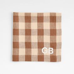 Walnut brown and creamy natural lines intersect in a modern buffalo check napkin with homespun charm. Our sustainable linen napkin unfolds to a lavish 22-inch square with generous hems. Prewashed for extra softness, the machine-washable cloth is finished with mitered tailoring—diagonal seaming that creates crisp corners. We love the way this buffalo plaid napkin pairs with our natural-hued artisanal dinnerware to set a warmly welcoming table.   View our Marin collection       Set of 8 napkins  1 Dorm Shopping, Plaid Napkins, Flax Fiber, Wedding Gift Registry, Natural Line, Plant Fibres, Linen Napkins, Buffalo Check, Unique Furniture