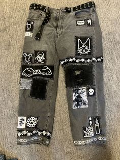 a pair of jeans with patches on them