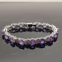 PRODUCT CODE - BST-405-AT STONE NAME - AMETHYST STONE SHAPE - ROUND FACETED CUT STONE DIMENSION - 7MM STONE WEIGHT - 19.00 CTS COLOR - PURPLE TOTAL WEIGHT - 19.700 GRAMS Metal - * Guaranteed Pure 925 Sterling Silver * Skin Friendly / Allergy Free * Suitable For Every Skin * Long Time Polish * Shining Silver * Soft Touching Shipping Policy :- * Shipping Thru FedEx, DHL Express, USPS & Other Courier Services. * We ship item(s) from India to Worldwide in 24 hr. ( 1 working day ) after the payment h Purple Round Bracelets For Anniversary, Bracelet Tennis, Wedding Jewelry Bracelets, Bridal Gift, Amethyst Jewelry, Amethyst Bracelet, Amethyst Stone, Wedding Bracelet, Bridal Gifts