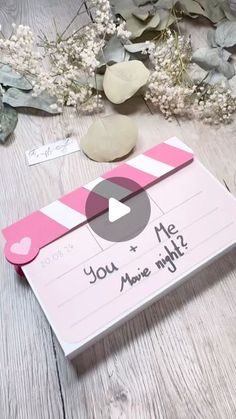 a pink and white card with the words you are mine on it next to some flowers