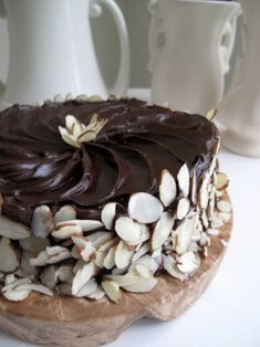 there is a chocolate cake with nuts on it